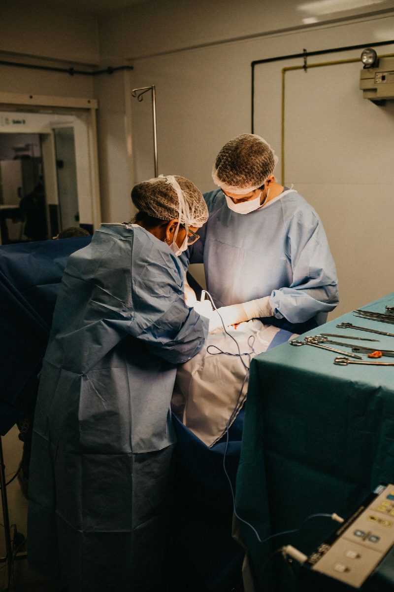 A cardiologist reviewing recovery at a follow-up