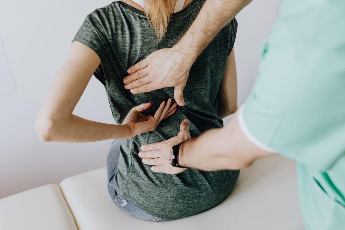 A dermatologist reviewing a skin-cancer screening